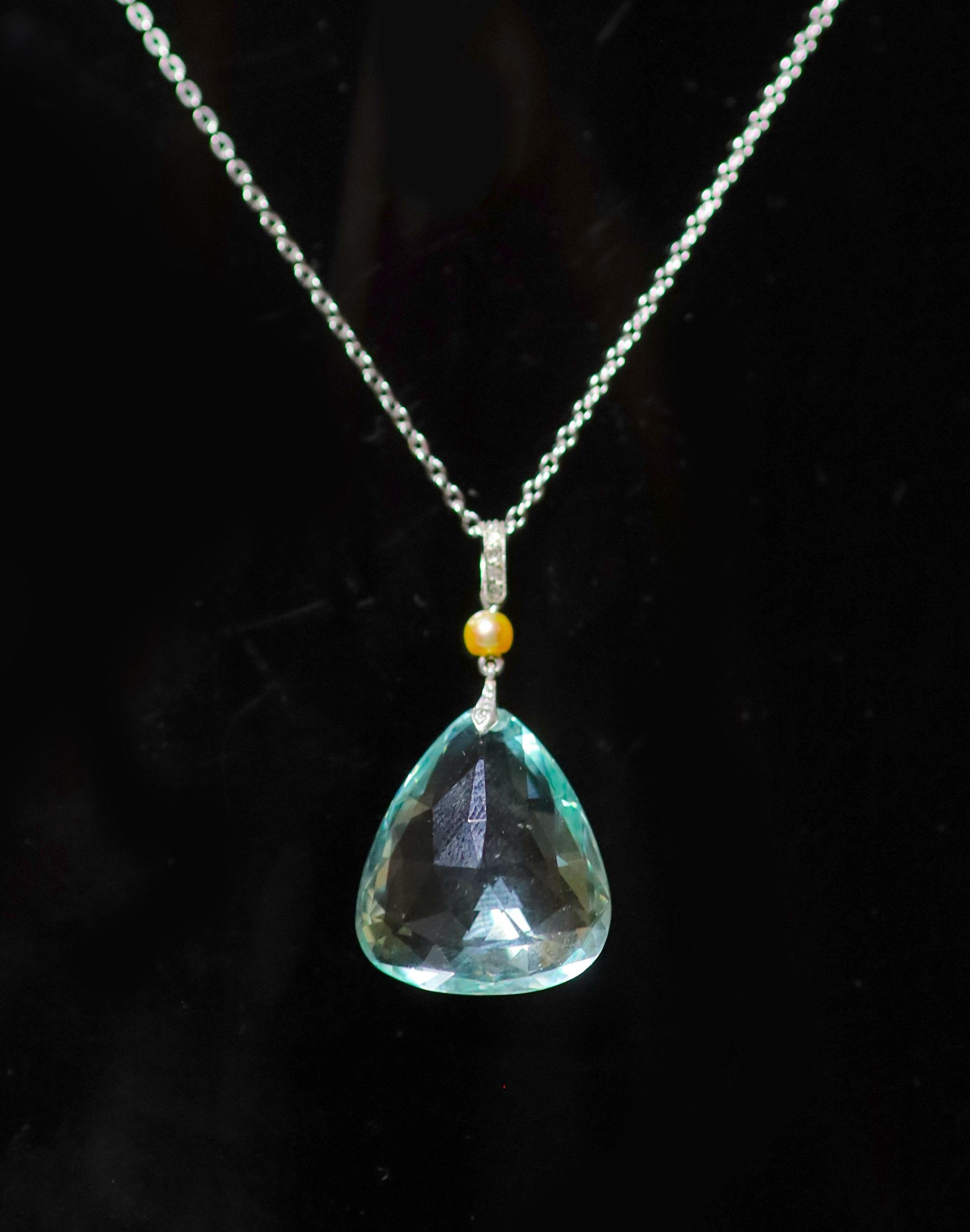 A mid 20th century white gold, seed pearl, rose cut diamond and fancy facet cut triangular aquamarine set pendant